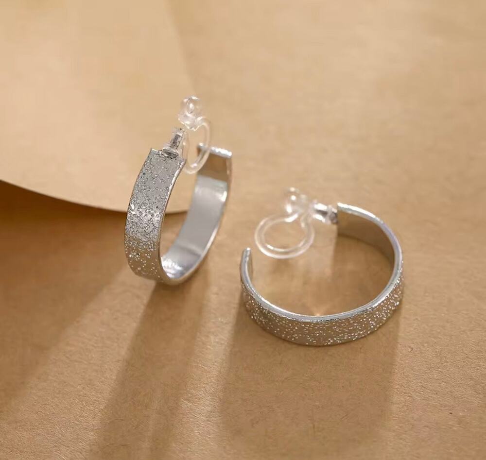 Clip on 1" plastic clasp silver textured wide flat hoop earrings